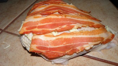 Chicken breast covered with bacon then baked