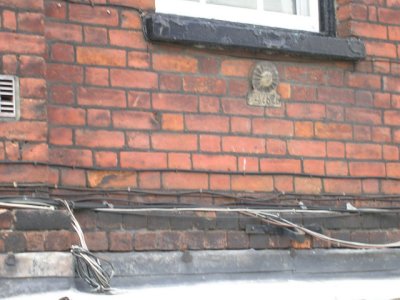 The badge on this building indicated that the owner had paid for fire protection