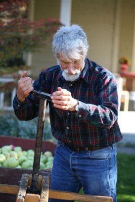 Larry Hibbard Working His Cider Press