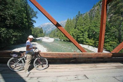  Biker Enjoying View Of Stehekin River And Looking For Spawning Fish