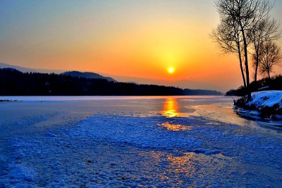The winter sunset on the river Drava