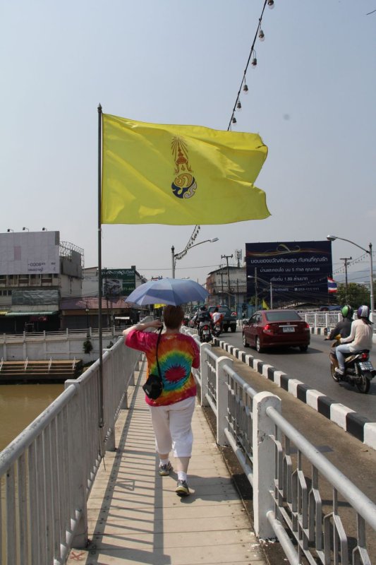 Walking accross the Nakhon Phing Bridge over the Mae Ping River