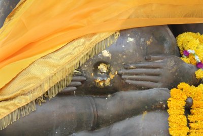 Wat Mongkhon Bophit Buddha belly button with gold leaf