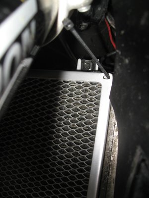 Installing zip tie through corner in radiator