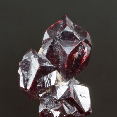 10 mm group of interpenetrant twinned cinnabar crystals, Gorlovka, Ukraine.