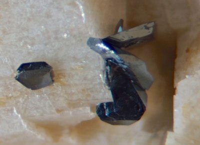 Slieve Binnian microperthite feldspar crystals to 12 mm, smokey quartz to 10 mm and tiny hematite crystals to 1 mm.