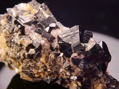 Cassiterite cyclic twins on 7 cm matrix. Zinnwald, Erzgebirge Krusne Hory Mts, Saxony & Usti Region, Germany & Czech Republic.