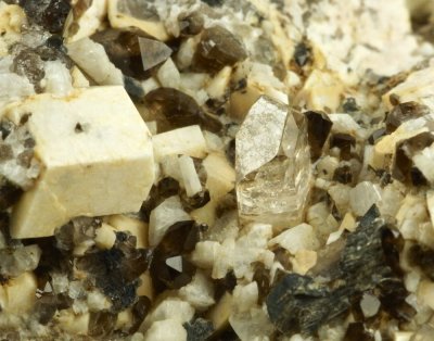 Fine sharp topaz crystal, ca 7 mm, on 6 cm matrix, Diamond Rocks, Mourne Mountains.