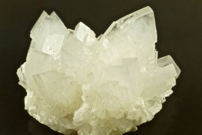 4 cm group of sharp white lustrous barite crystals to 23 mm. Dam Rigg Level, Northside Mines, Arkengarthdale, North Yorkshire