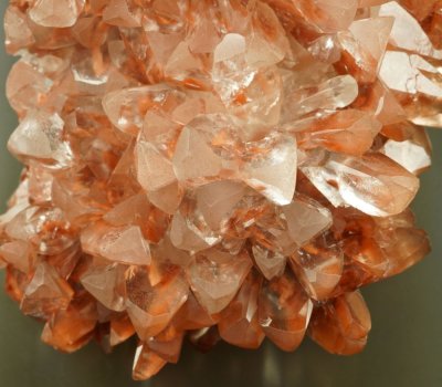Calcite crystals with hematite-stained phantoms, Bigrigg Mines, Egremont, Cumbria. Crystals to 2 cm in 85 mm group.