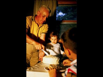 Dad cutting birthday cake