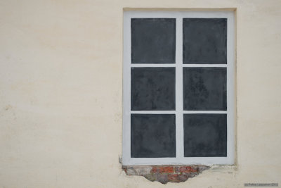 Fake window with falling plaster