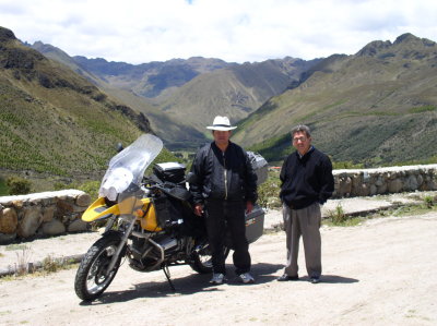 For two Ecuadorians on a bus trip a big motorcycle is always a draw.