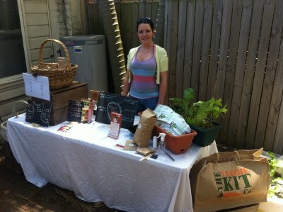 Pam and her veggie stand in our backyard