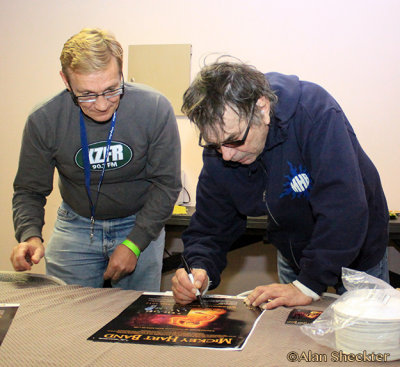 Mickey Hart signs poster for public radio - KZFR Underwriting Director Ray Laager