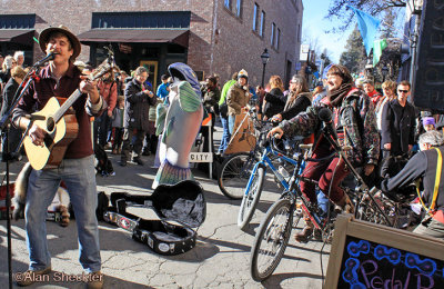 Austin Quattlebaum entertains via pedal-power, at the end of the Climate Action parade 