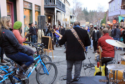Tyler Matthew Smith performs at the pedal-powered stage on Commercial Street