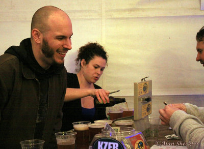 Brother and sister volunteers Evan and Acacia staff the busy Sierra Nevada beer table