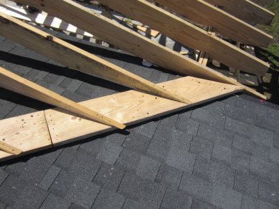 Board nailed to roof; joists nailed to board