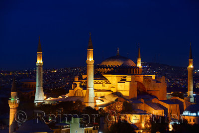 Night lights on Hagia Sophia and Firuz Aga Mosque at twilight in Istanbul Turkey