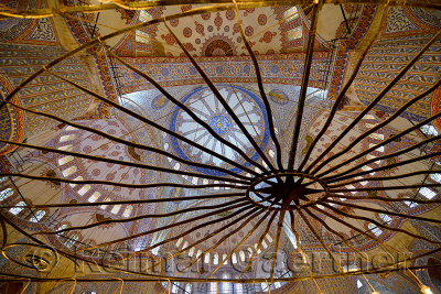 Ceiling of the Blue Mosque Istanbul Turkey seen through wrought iron star chandelier