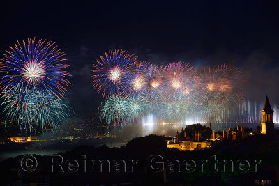 Blue Republic Day fireworks on the Bosphorus with Bridge lights and Topkapi and Dolmabahce Palaces Istanbul