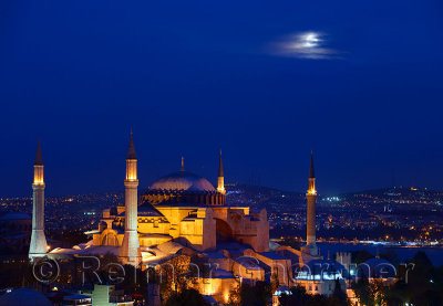 Night lights on Hagia Sophia under a full moon at twilight in Istanbul Turkey