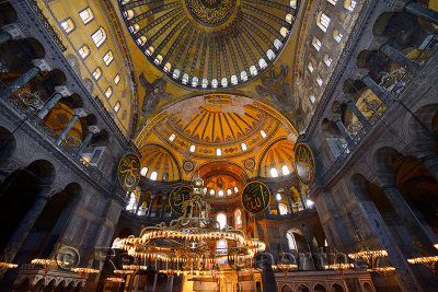 Ceiling domes and lit chandeliers with six winged Saraphim in the Hagia Sophia Istanbul