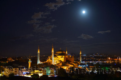 Night lights on Hagia Sophia under a clear full moon at night in Istanbul Turkey