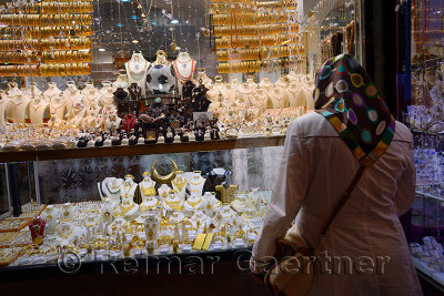 Turkish woman at a jewelery shop in the covered Egyptian Spice Bazaar Istanbul Turkey