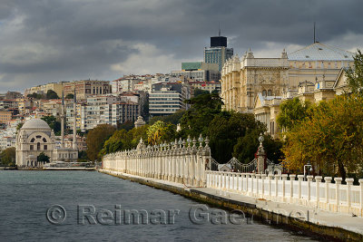 Dolmabahce Mosque and Palace surrounded by modern buildings on the Bosphorus Strait Istanbul