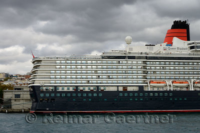Queen Elizabeth Cruise ship on the Bosphorus Strait at Istanbul with clouds