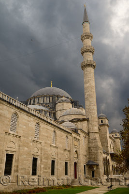 Front facade of Suleymaniye Mosque with storm clouds Istanbul Turkey