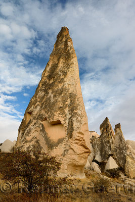 Pointed Rock spires of the Red Valley with cave house Cappadocia Turkey