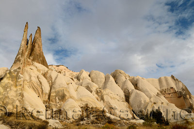 Rock spires of the Red Valley with cave house Cappadocia Turkey