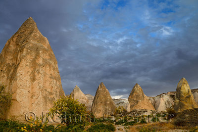 Evening light on pointed Rock spires of the Red Valley Cappadocia Turkey