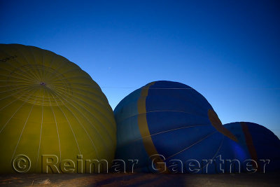 Venus rising at twilight over hot air balloons being inflated in Cappadocia Turkey