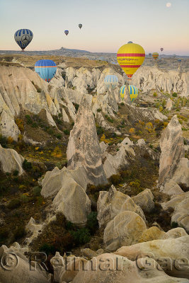 View from hot air balloon over the Red Valley with Uchisar in Cappadocia Turkey at dawn with moon