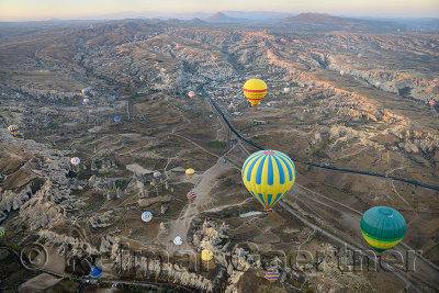 Aerial view of Rose and Red Valleys Goreme first light on Uchisar and Goreme National Park from a hot air balloon