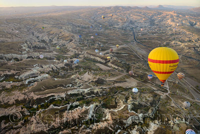 Aerial view of Zelve Valley with Rose and Red Valleys Goreme and Uchisar at first light from a hot air balloon Cappadocia
