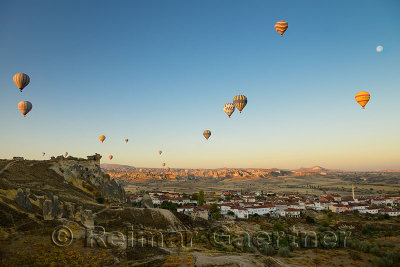Hot air balloon view of Cavusin with abandoned cave house church and Goreme Park Cappadocia Turkey