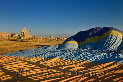 Deflating hot air balloon on the ground in Cappadocia Turkey