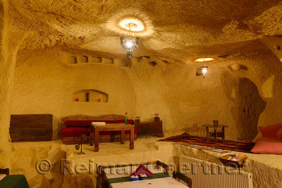 Interior of Urgup Evi rock house cave hotel restaurant carved out of volcanic tuff in Cappadocia Turkey