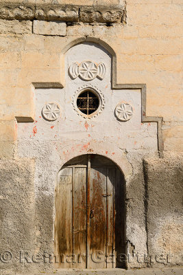 Old weathered door of stone house in Mustafapasa village Cappadocia Turkey