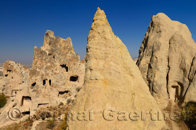 Fairy Chimney caves at Goreme Valley Open Air Museum Turkey with Nunnery and Buckle Church