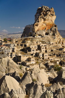 Fairy Chimneys Houses and Ortasihar Castle rock being repaired as a museum Cappadocia Turkey