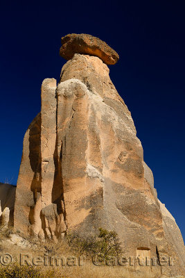 Single Fairy Chimney with blue sky on the western outskirts of Urgup Cappadocia Turkey