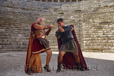 Roman Gladiators sword fighting on the stage at Aspendos theatre Turkey