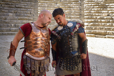 Roman Gladiators glowering before sword fight on stage at Aspendos theatre Turkey