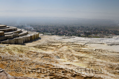 Lookout point over dry hot spring pools of travertine terraces at Pamukkale Turkey